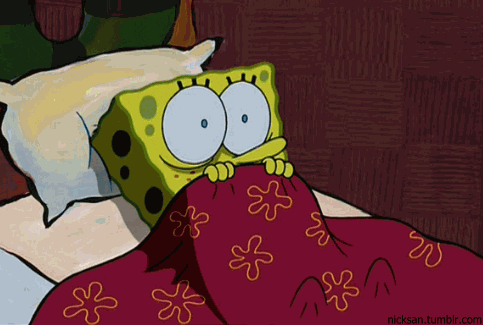 a gif of spongebob huddled under covers, looking scared