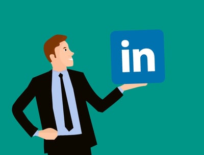 cartoon of a businessman holding the LinkedIn logo