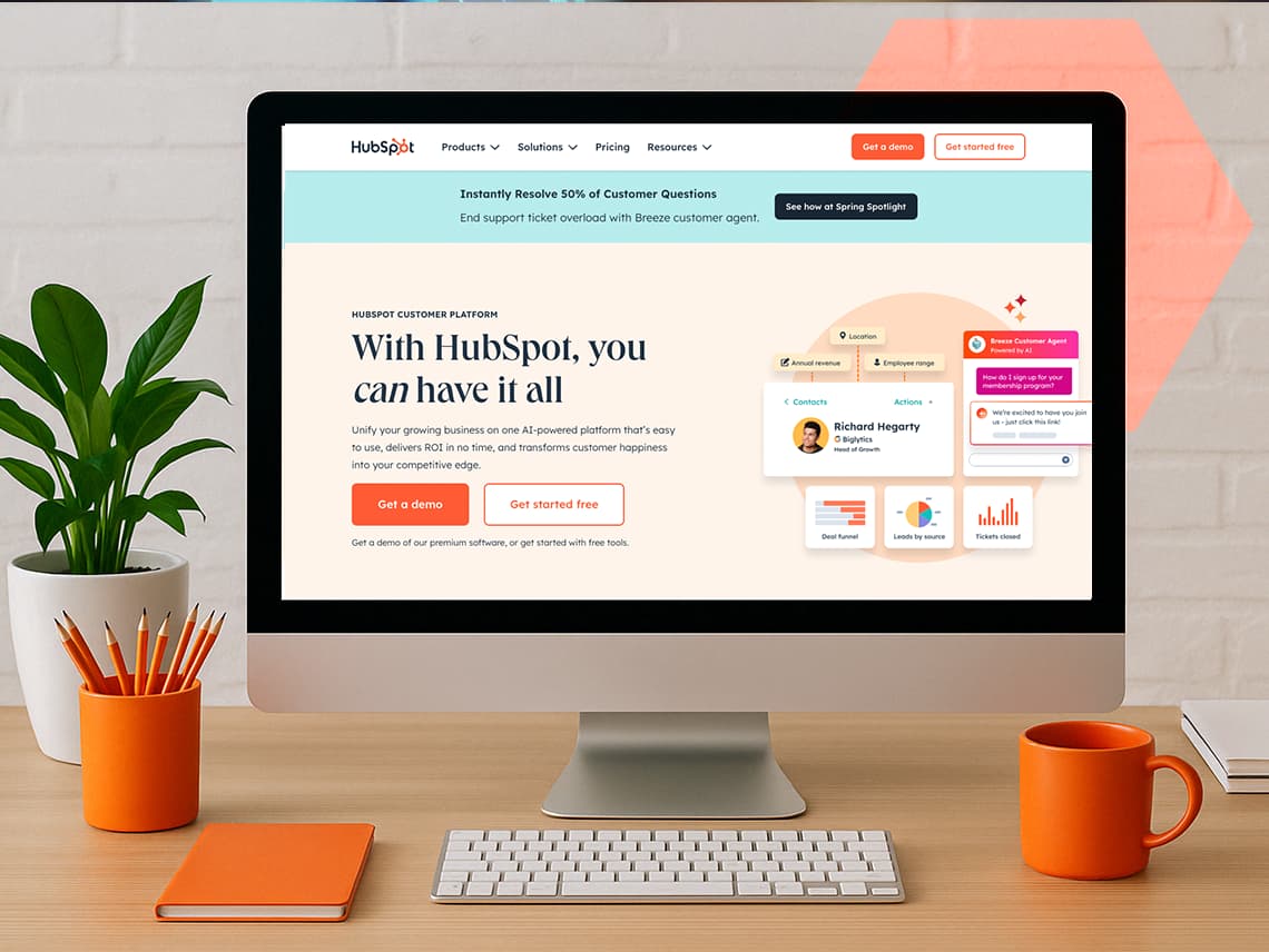 a desktop computer displaying HubSpot's main login screen.
