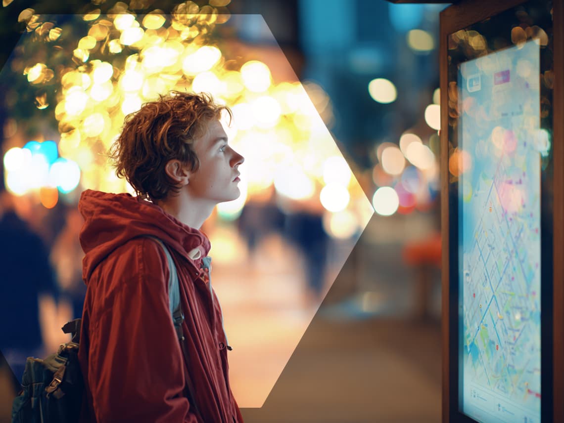 a young man standing in front of a map. overlaid is a diamond shape that follows his eyes.