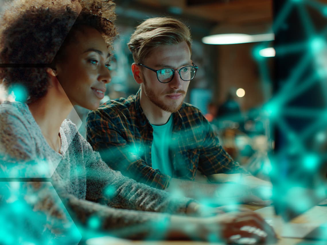 two marketers reviewing their hubspot portal