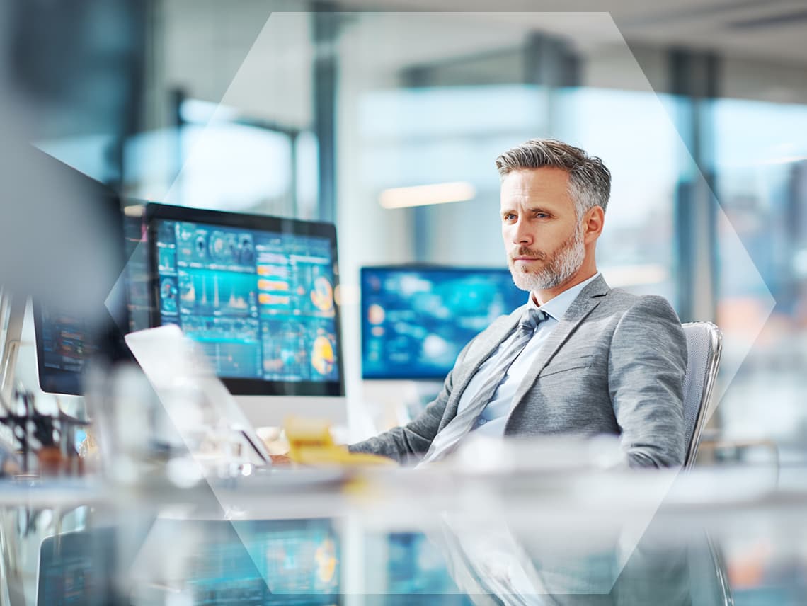 a sales person staring pensively at a computer